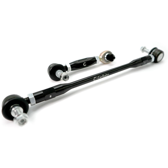 Two black metal control arms with silver bolts on a white background