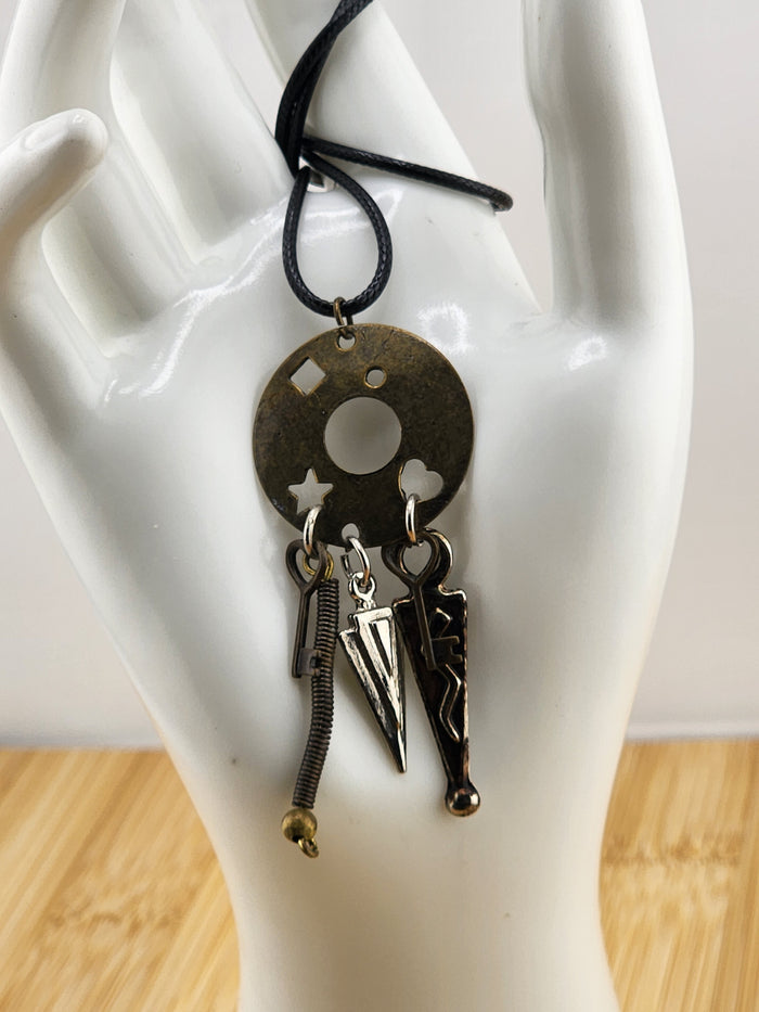 Black Cord Necklace with Antiqued Metal Charm Disc and Dangling Charms