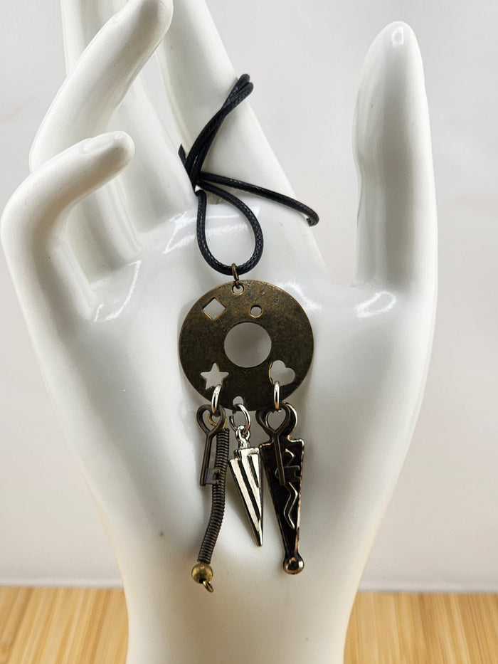 Black Cord Necklace with Antiqued Metal Charm Disc and Dangling Charms