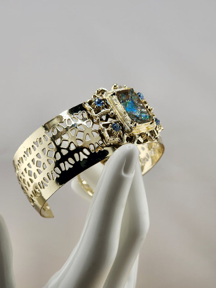 Gold Tone Cuff Bracelet with Multicolor Center Stone and Blue Accent Gems 0543