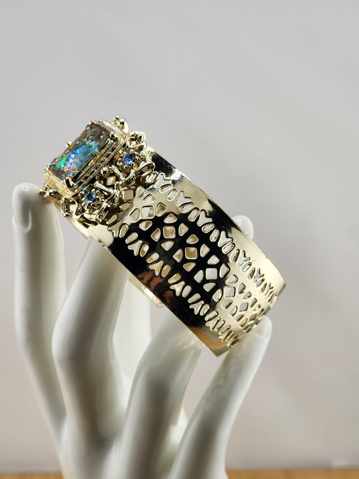 Gold Tone Cuff Bracelet with Multicolor Center Stone and Blue Accent Gems 0543
