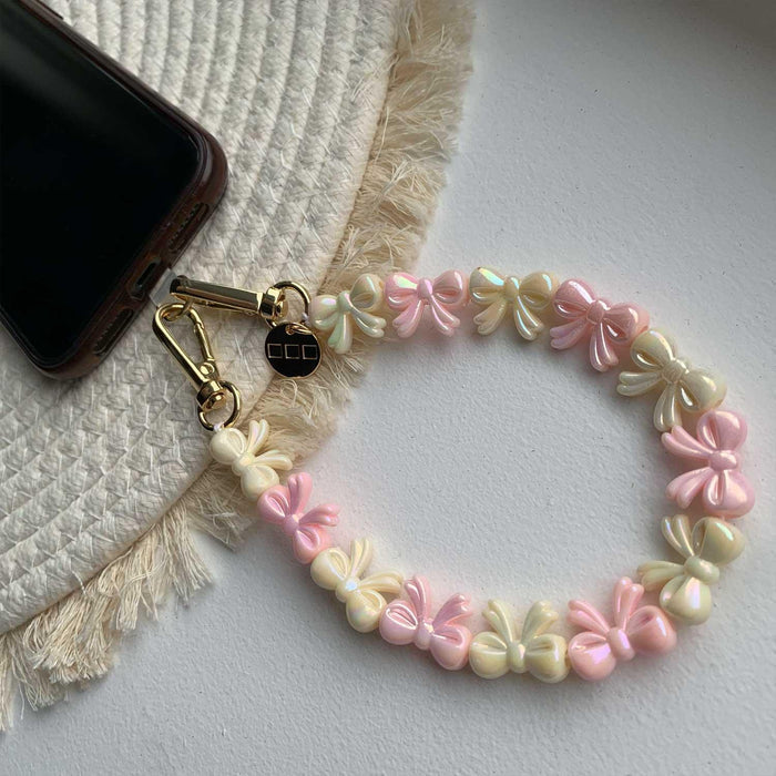 Telefoonkoord Bow - lichtroze wit - goud