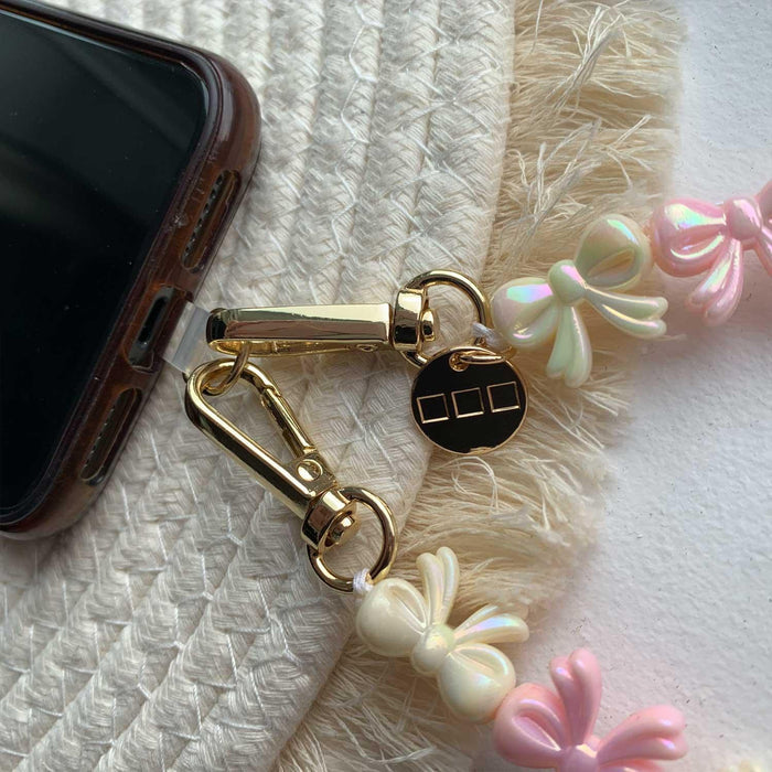 Telefoonkoord Bow - lichtroze wit - goud