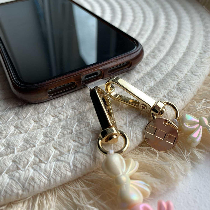 Telefoonkoord Bow - lichtroze wit - goud