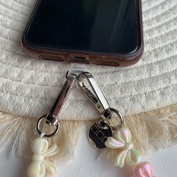 Telefoonkoord Bow - lichtroze wit - zilver